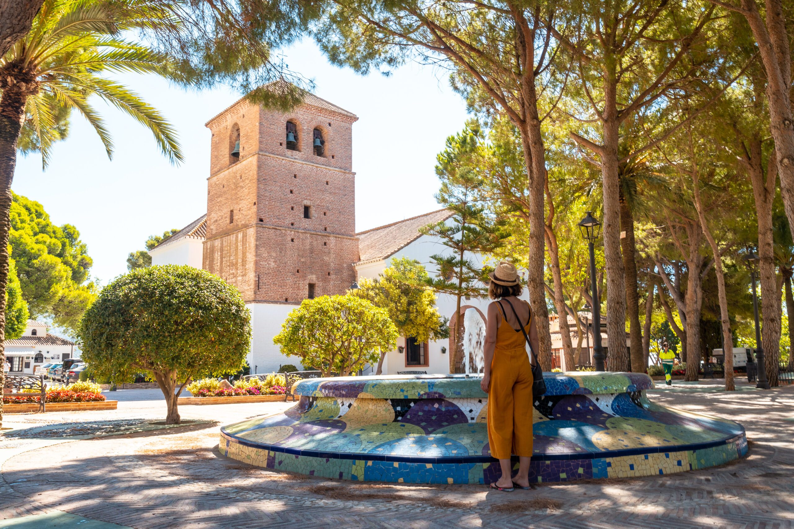 A young woman at the Immaculate Conception Church in the charming town of Malaga province, Andalucia